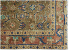 A vintage Persian Hamadan runner featuring a brown field with intricate floral patterns and borders.
