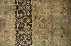 A vintage Persian Hamadan runner featuring a geometric floral pattern in brown, blue, and tan.