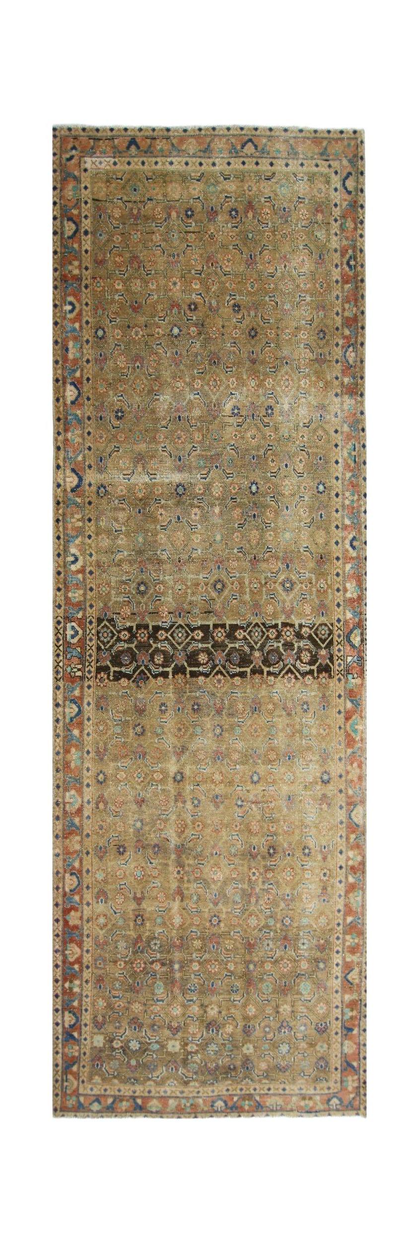 A vintage Persian Hamadan runner featuring a repeating floral pattern in muted earth tones.