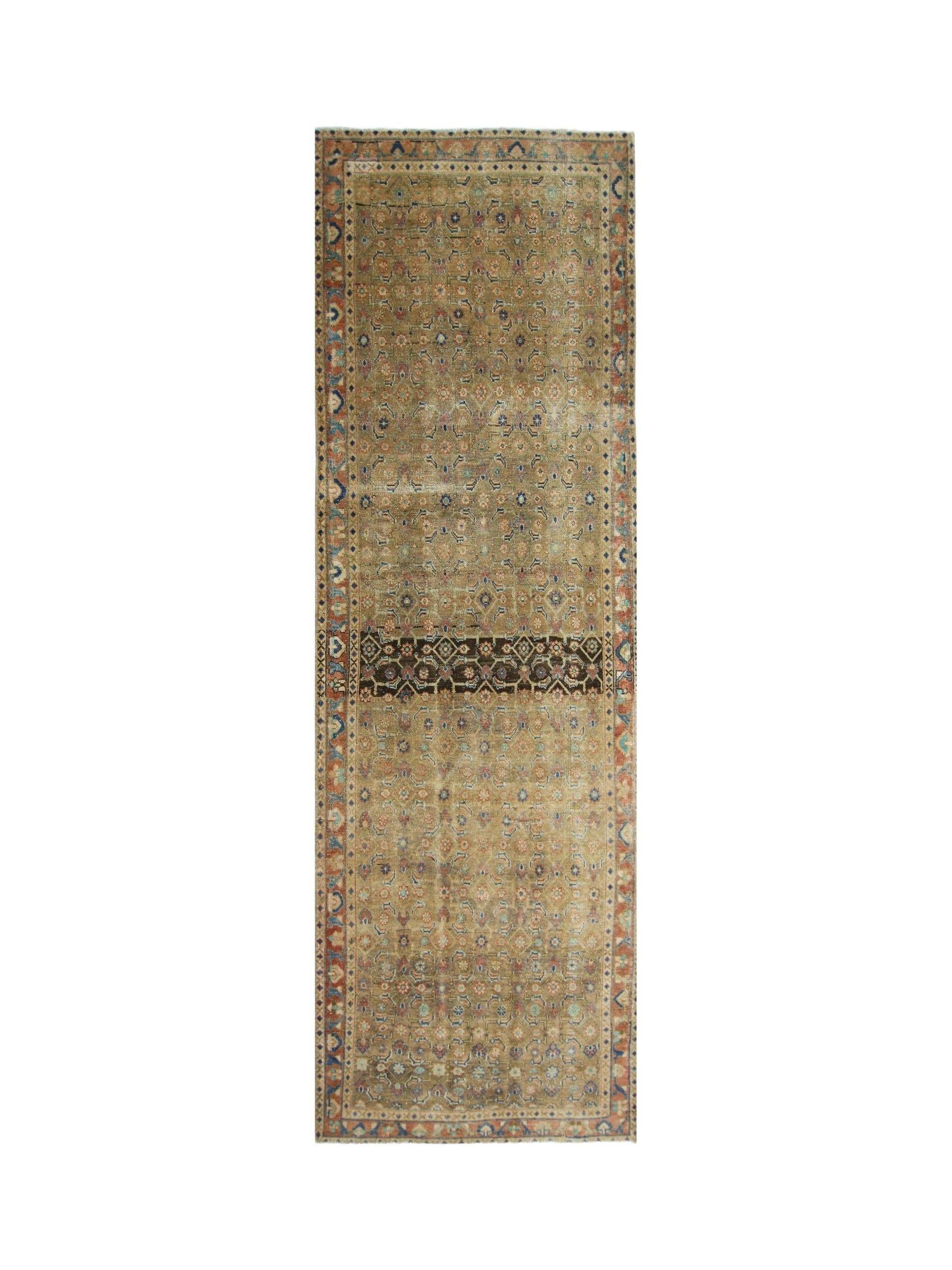 A vintage Persian Hamadan runner featuring a repeating floral pattern in muted earth tones.