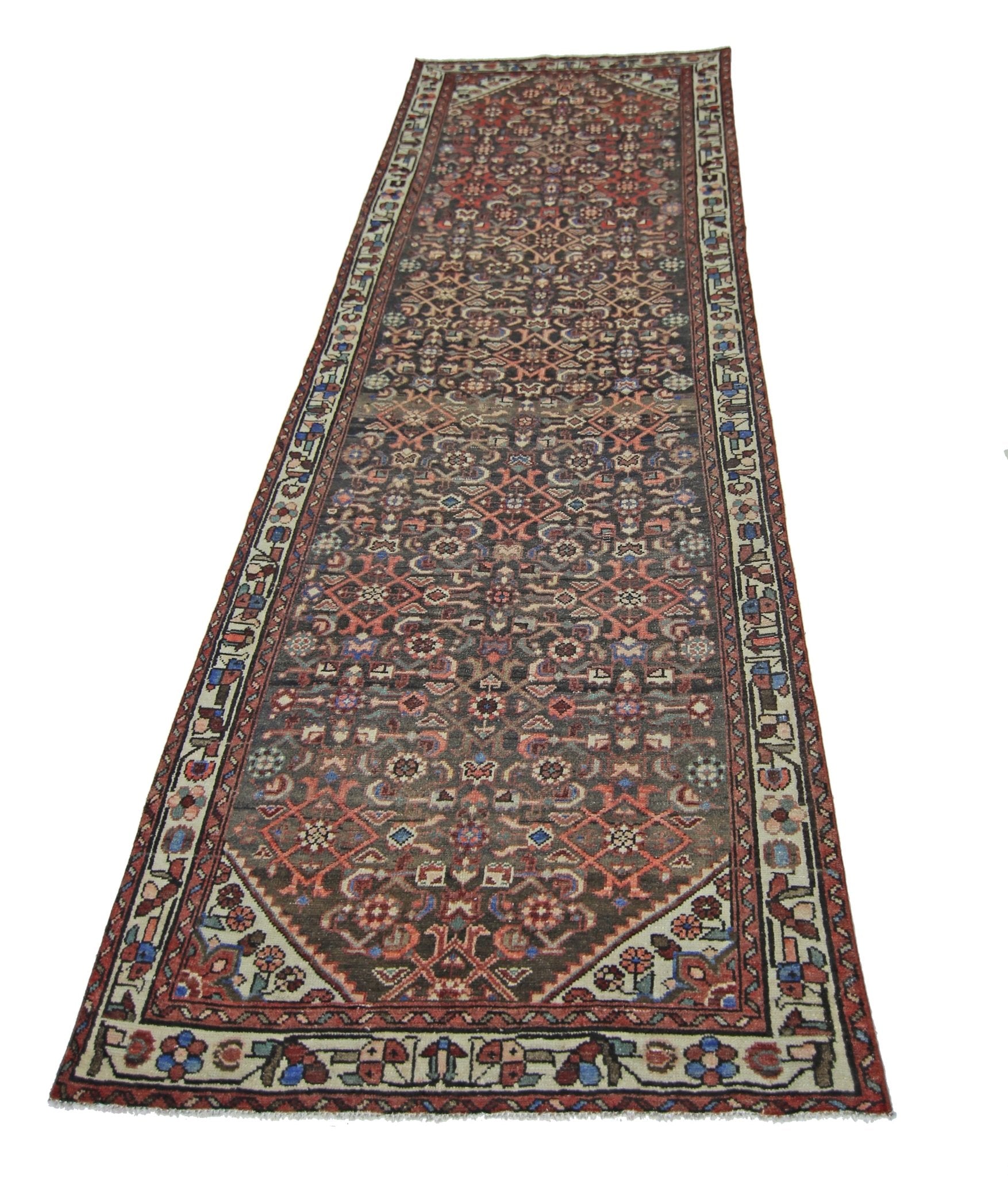 A vintage Persian Hamadan runner rug featuring a detailed geometric pattern in red and blue tones.