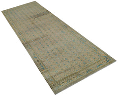 A vintage Persian Hamadan runner featuring a faded floral pattern in blue and beige tones.