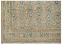 Vintage Persian Hamadan runner with a tan background and blue floral motifs.