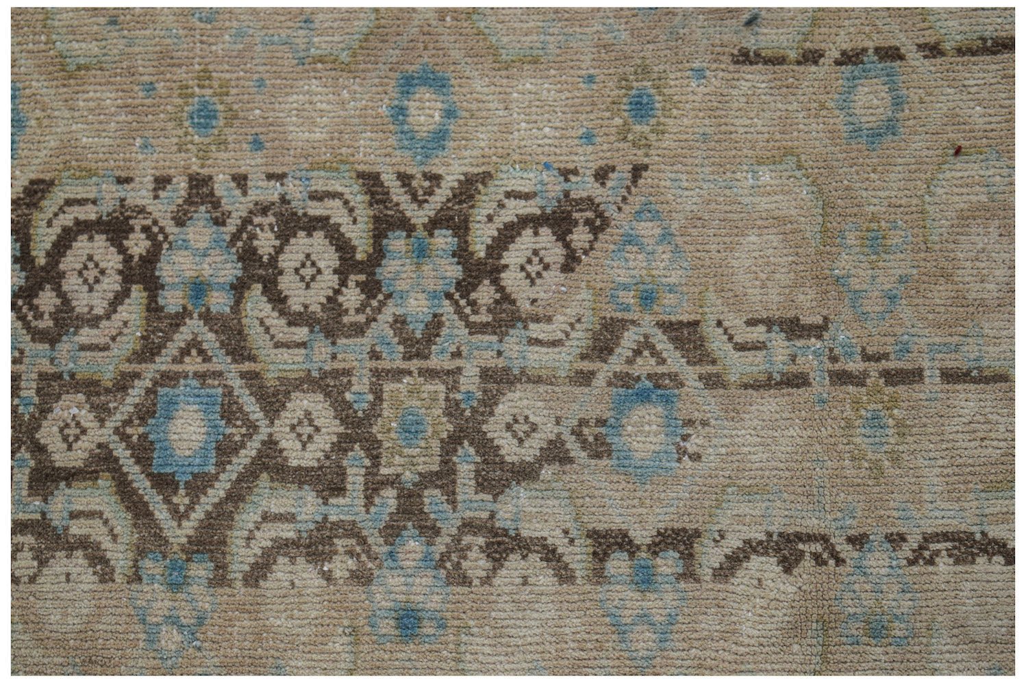 Vintage Persian Hamadan runner with brown and blue geometric patterns on a beige background.