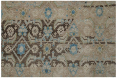 Vintage Persian Hamadan runner with brown and blue geometric patterns on a beige background.