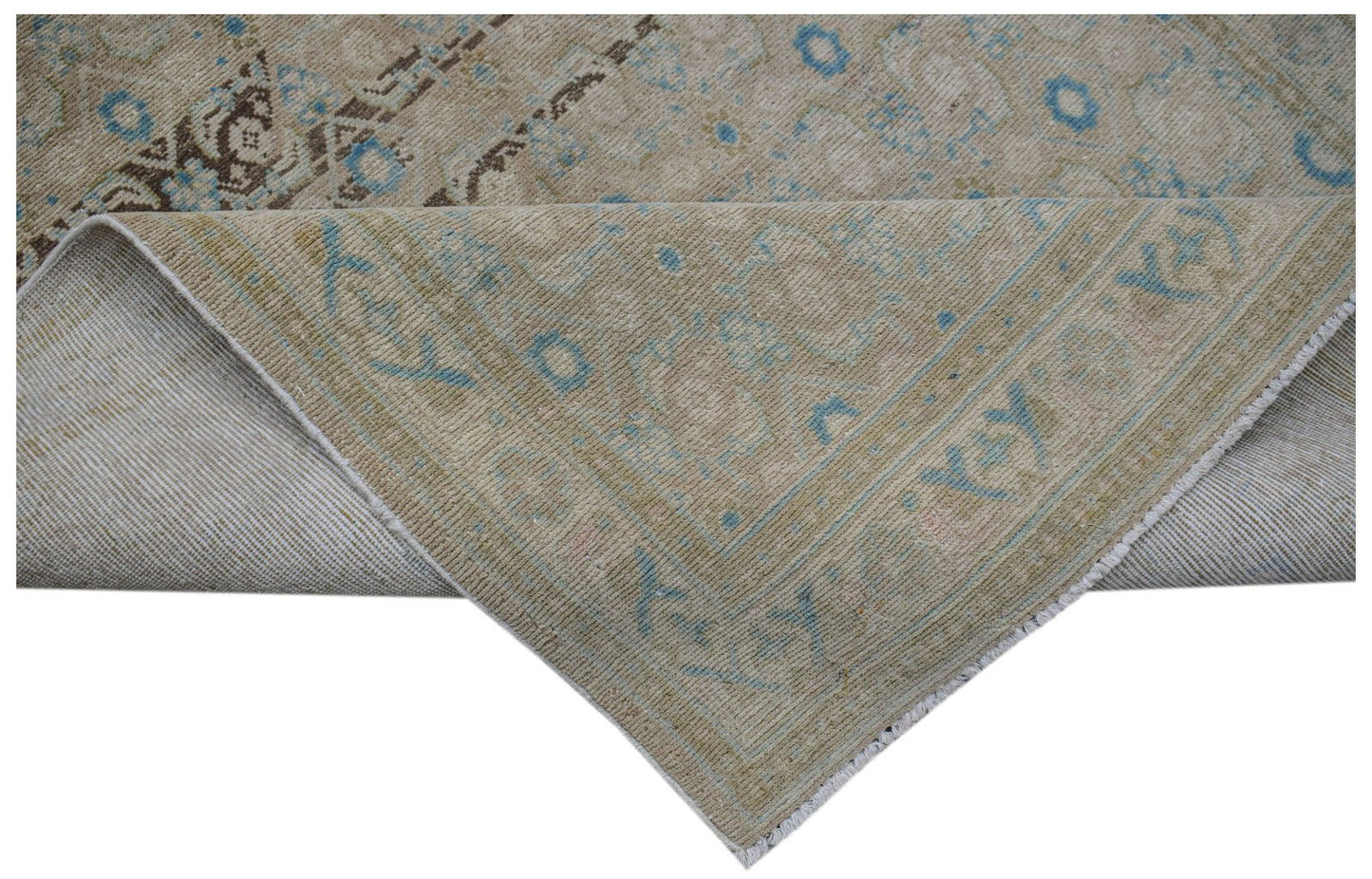A vintage Persian Hamadan runner featuring a faded beige pattern with blue and brown accents.