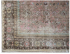 A vintage Persian Hamadan runner featuring a faded brown field with pink and blue floral motifs.