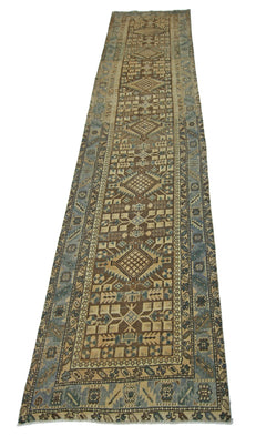 A vintage Persian Malayer runner featuring geometric patterns in blue and brown tones.