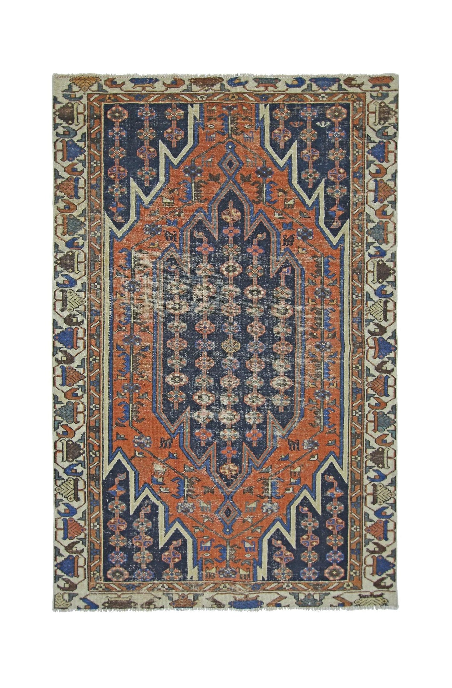 A vintage Persian Mazlaghan rug featuring a geometric medallion in rust orange and navy blue.