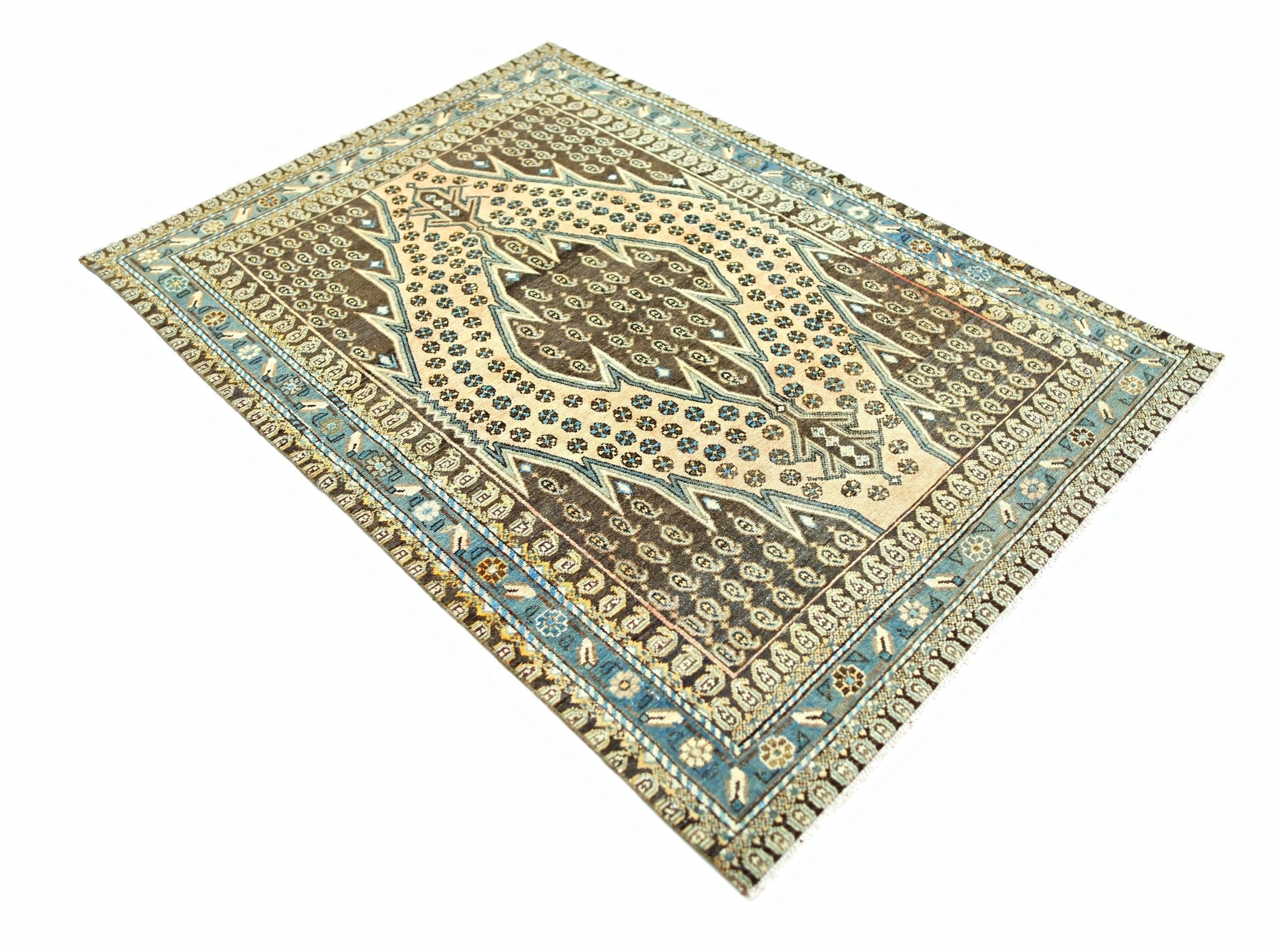 A vintage Persian Mazlaghan rug featuring a geometric medallion pattern in brown and blue tones.