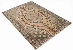A vintage handwoven Persian Mazlaghan rug featuring a geometric medallion in muted earth tones.