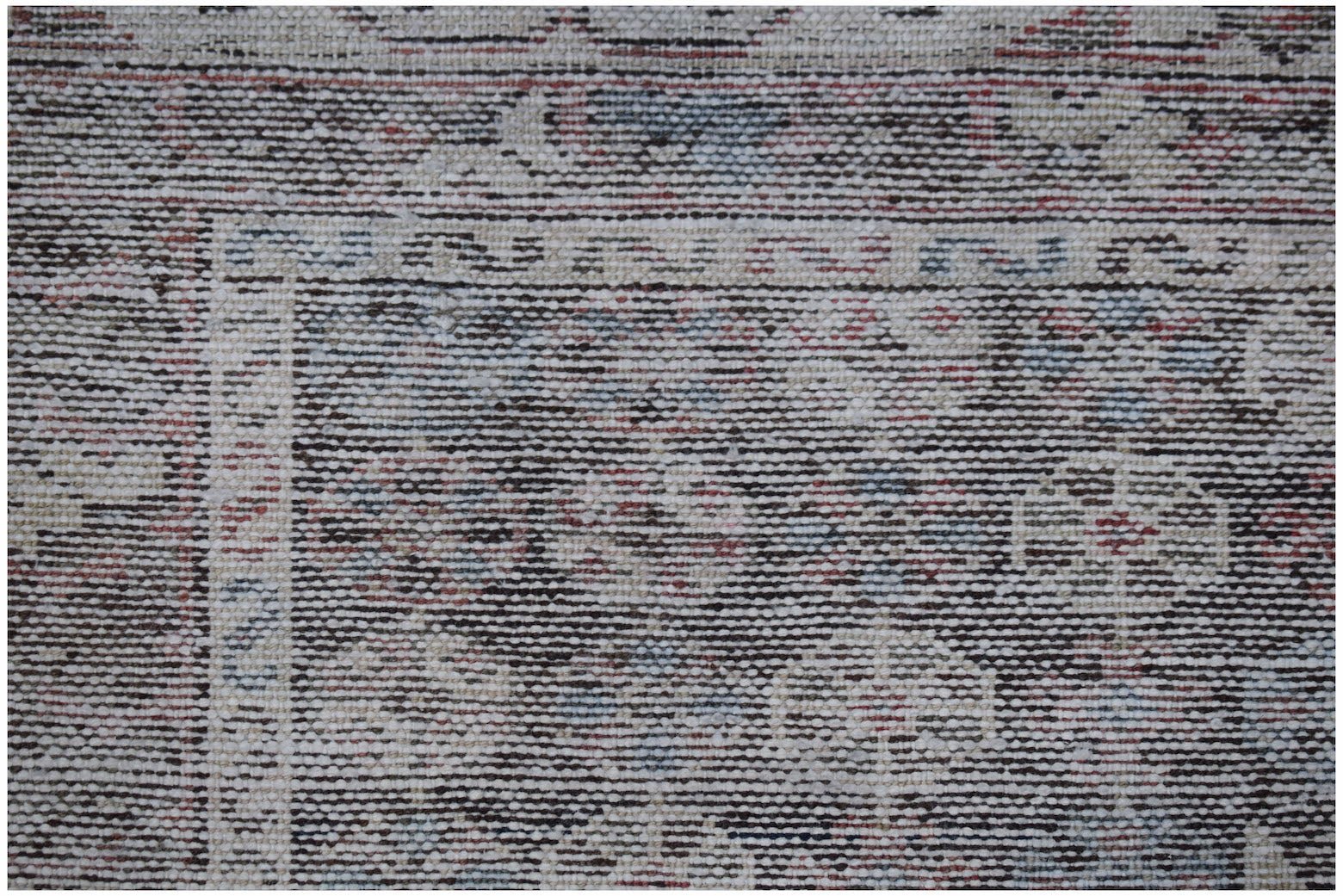 A vintage Persian Mazlaghan rug featuring a dark, intricate geometric pattern on a wool pile.