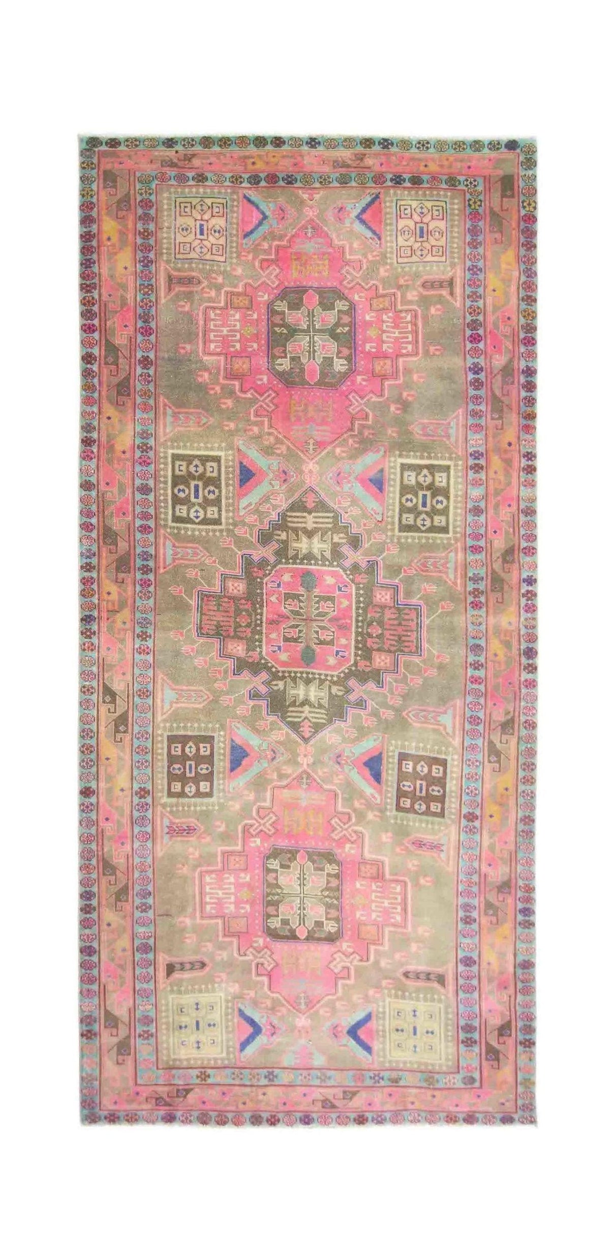 Vintage Persian Meshkin rug with a central medallion, geometric motifs, and a palette of faded pink, blue, and earthy tones.