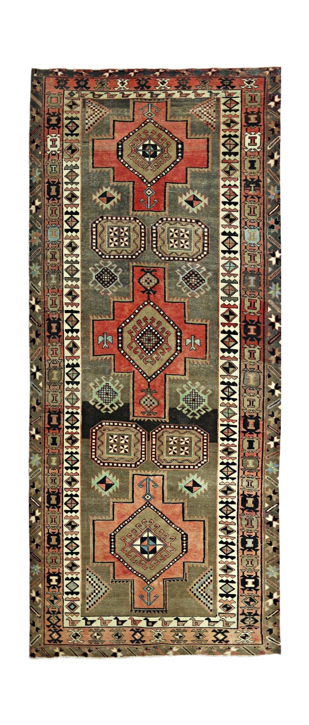 Vintage Persian Ardabil runner featuring three geometric medallions on a sage green field.