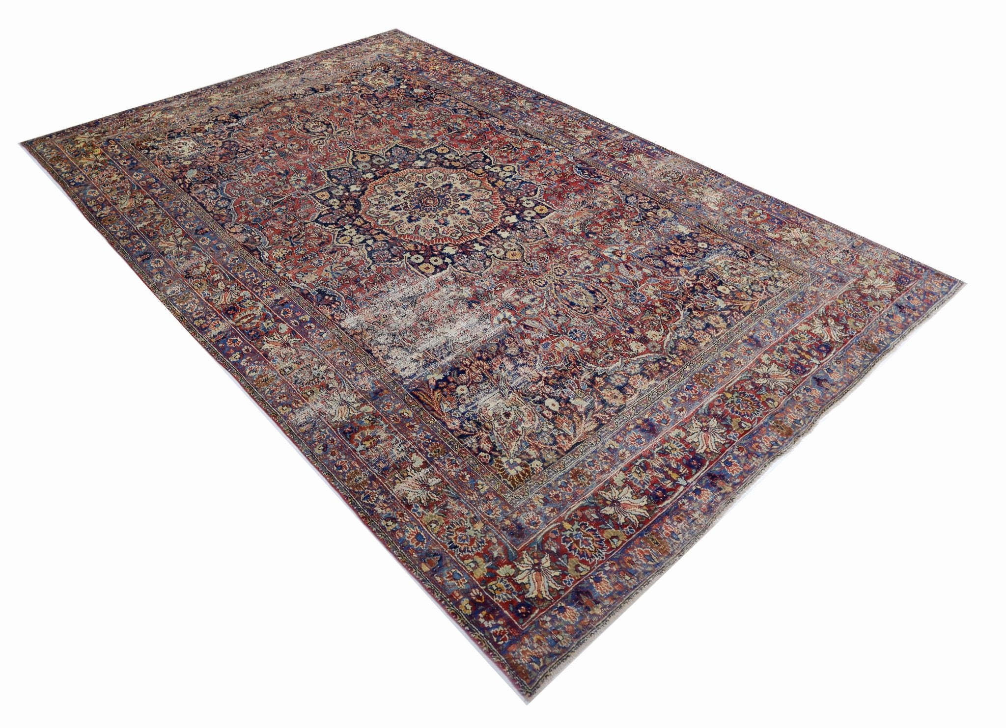 A vintage Persian Moud rug featuring a traditional floral medallion pattern in red and blue tones.