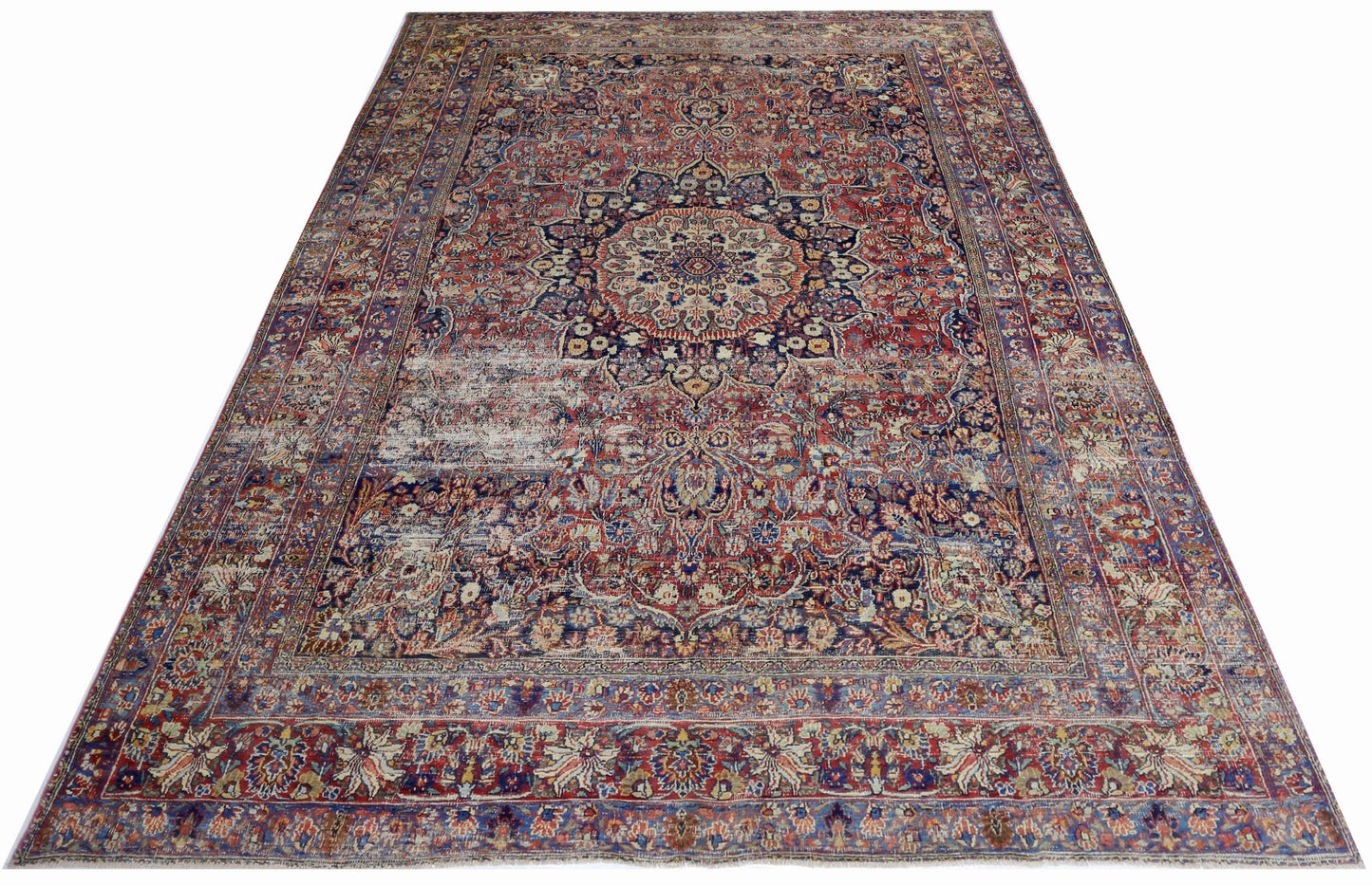A vintage Persian Moud rug featuring a central medallion and intricate floral patterns in red and blue.
