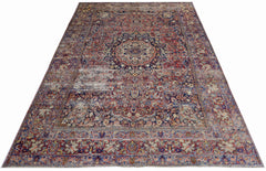 A vintage Persian Moud rug featuring a central medallion and intricate floral patterns in red and blue.