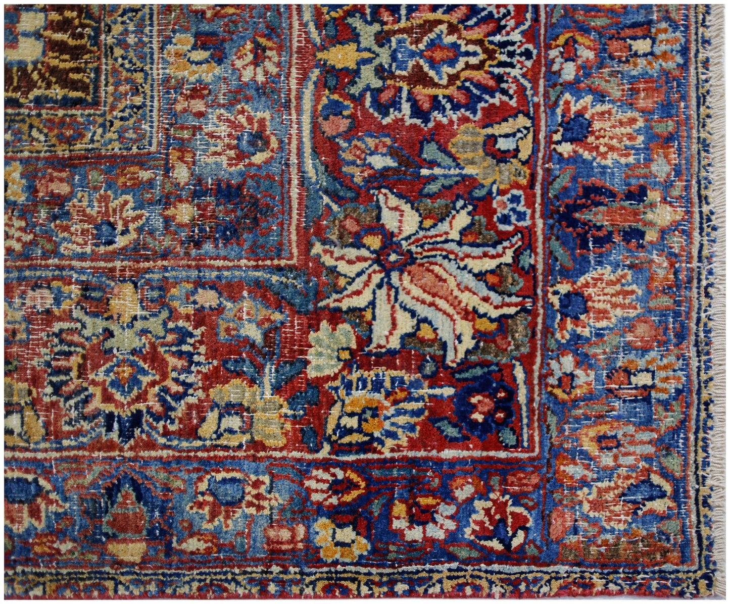 A vintage Persian Moud rug featuring a detailed floral pattern in red, blue, and cream tones.