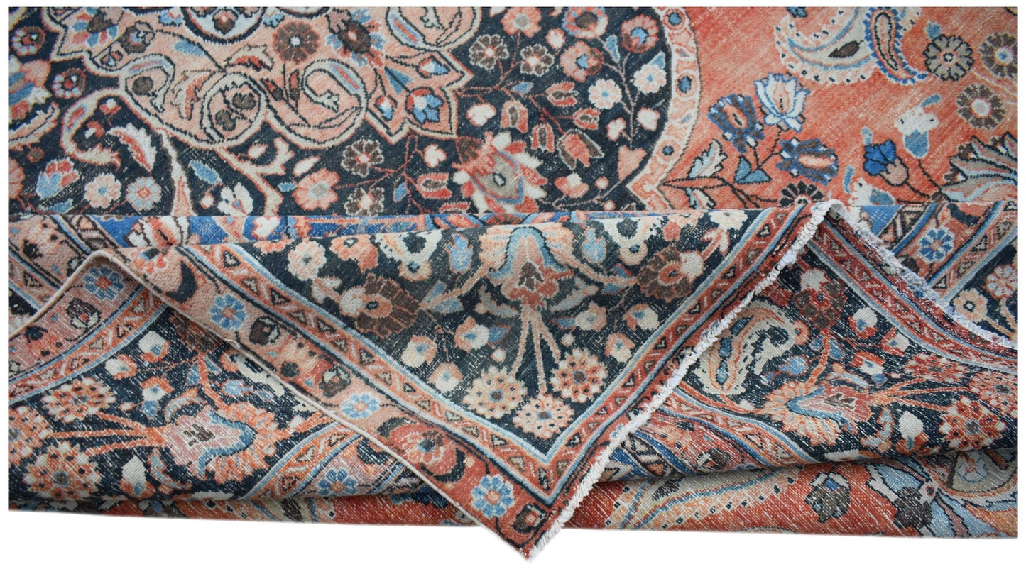 A vintage Persian Moud rug featuring intricate floral patterns in shades of orange and blue.