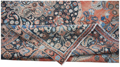 A vintage Persian Moud rug featuring intricate floral patterns in shades of orange and blue.