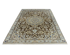 A vintage Persian Nain rug featuring an intricate floral medallion pattern in brown and cream.