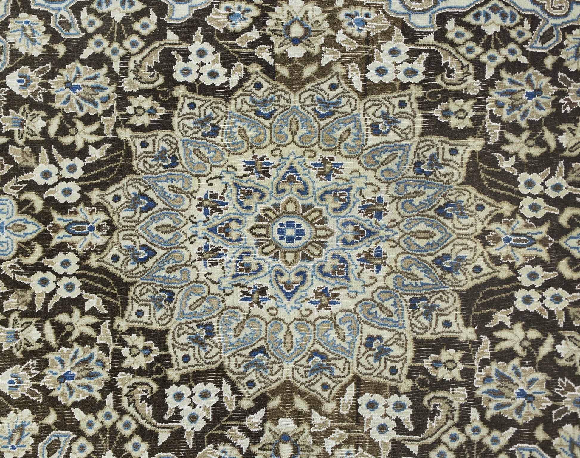 A vintage Persian Nain rug featuring an intricate floral medallion pattern in blue, beige, and brown.