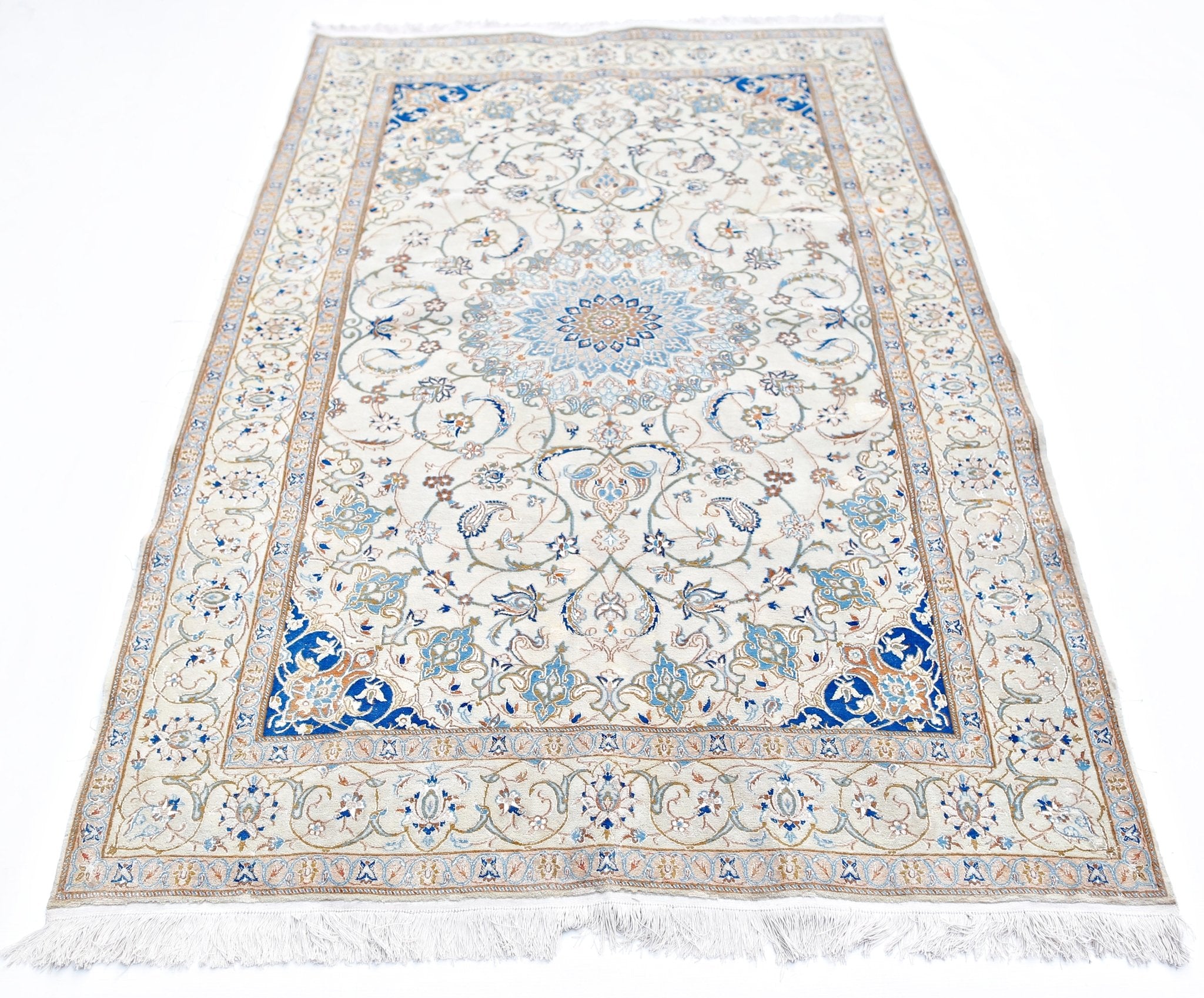 A vintage Persian Nain rug featuring an intricate blue and cream floral medallion design.