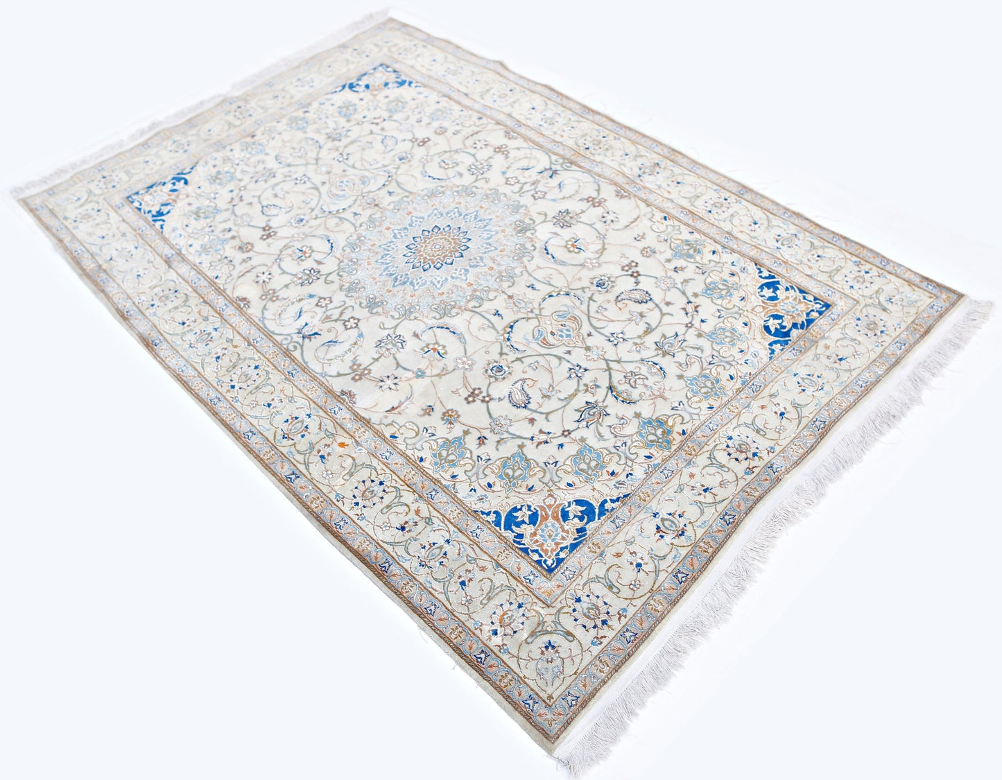 A vintage Persian Nain rug featuring an intricate floral pattern in blue and cream tones.