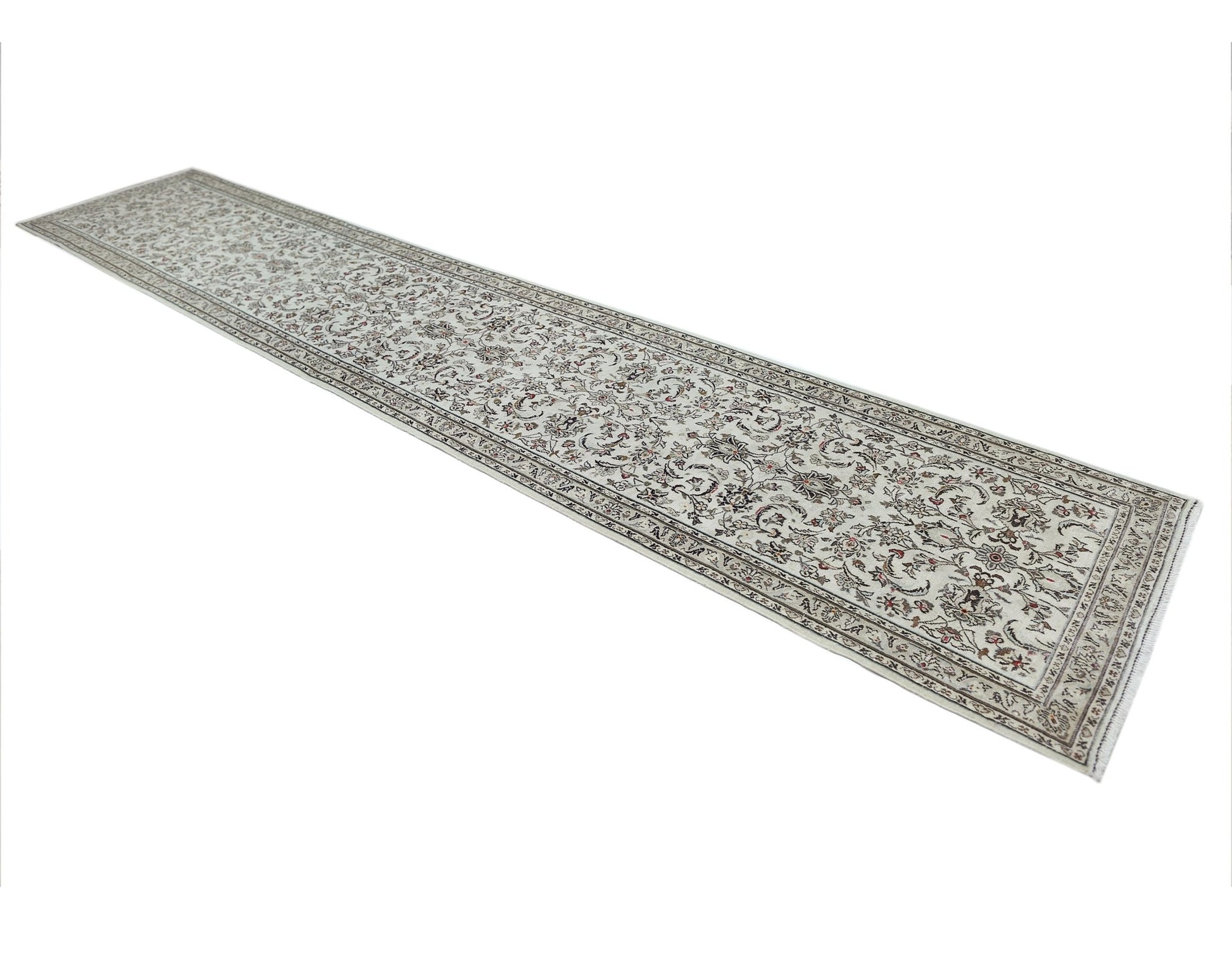 A long, vintage Persian Nain runner rug featuring an intricate floral pattern in neutral tones.