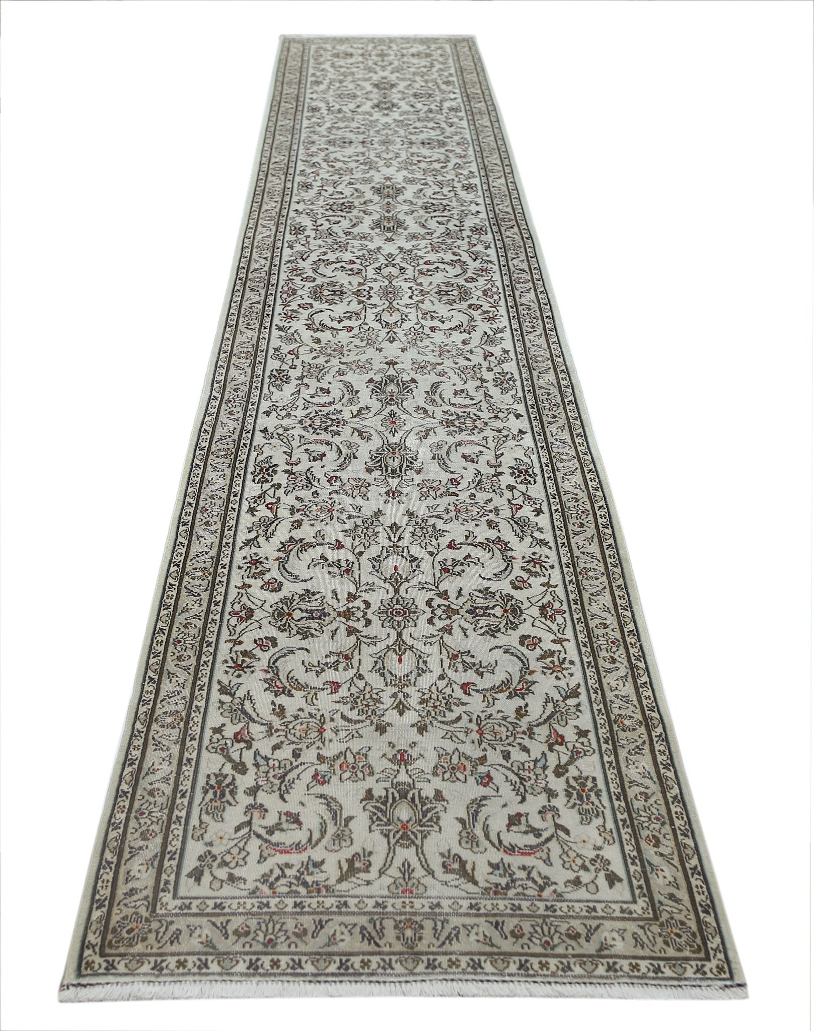A vintage Persian Nain runner featuring intricate floral patterns in neutral tones.
