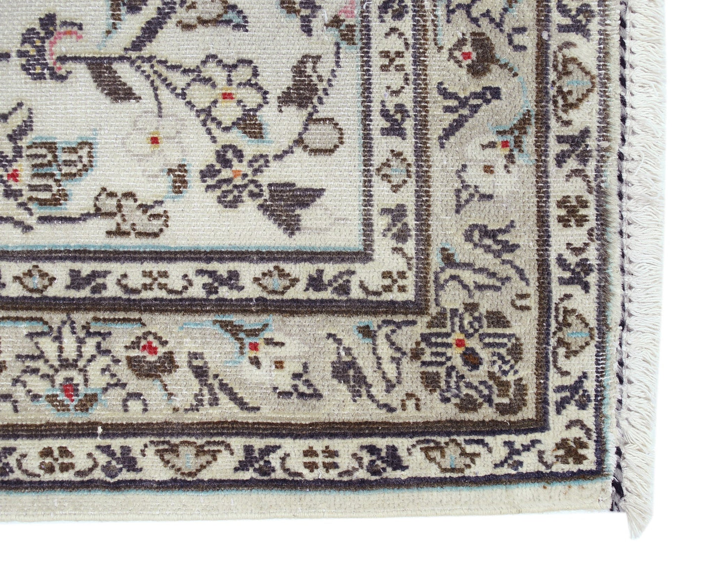 A vintage Persian Nain runner featuring intricate floral patterns in blue and brown on a cream base.