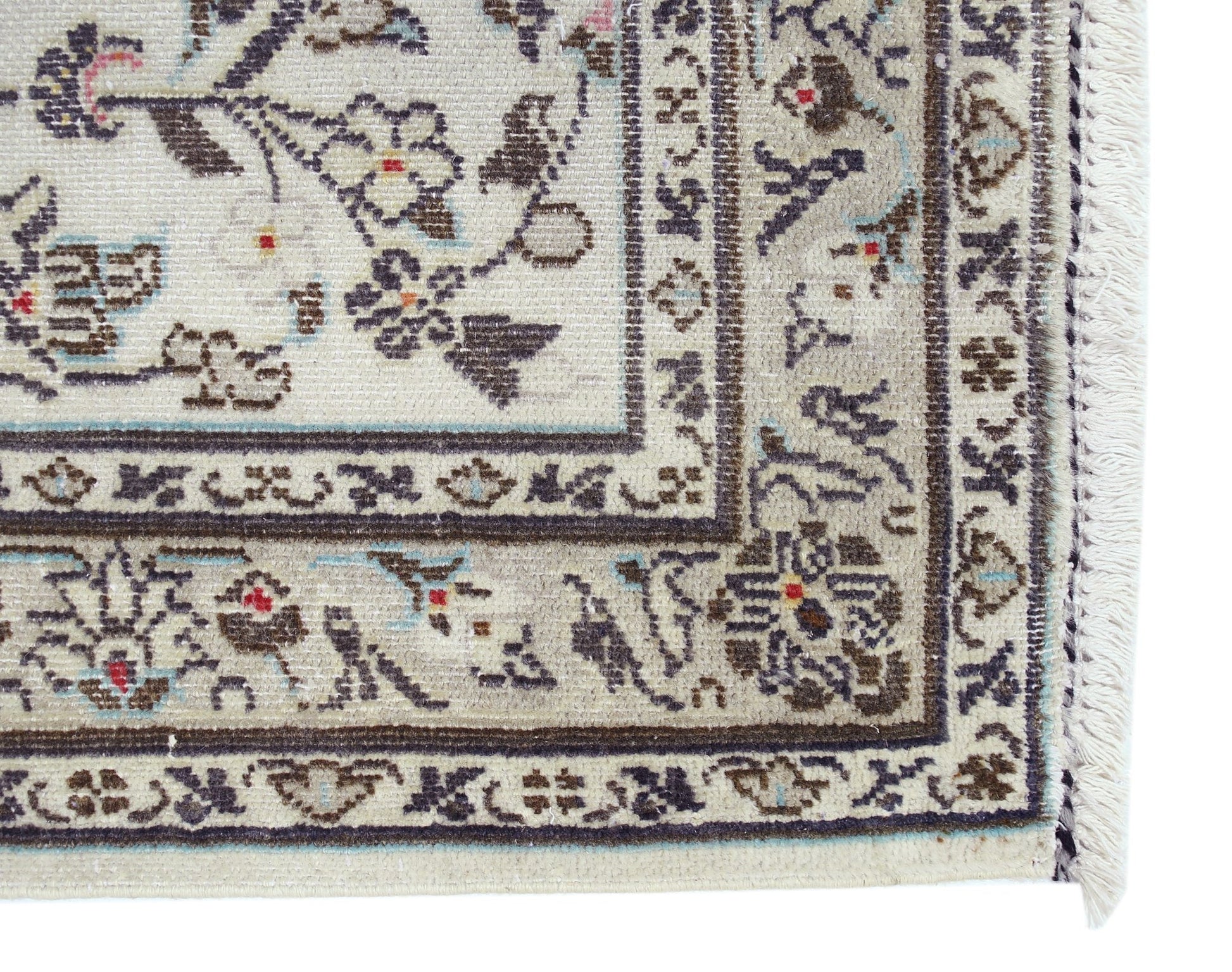 A vintage Persian Nain runner featuring intricate floral patterns in blue and brown on a cream base.