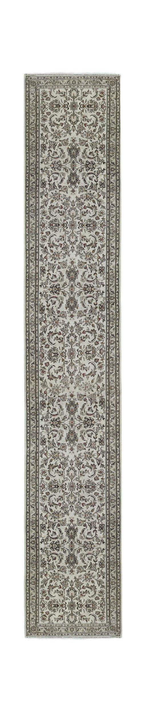 A vintage Persian Nain runner rug featuring an intricate floral pattern in cream and muted tones.
