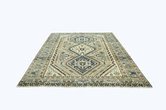 A vintage Persian Shiraz rug featuring a geometric diamond pattern in shades of blue and beige.