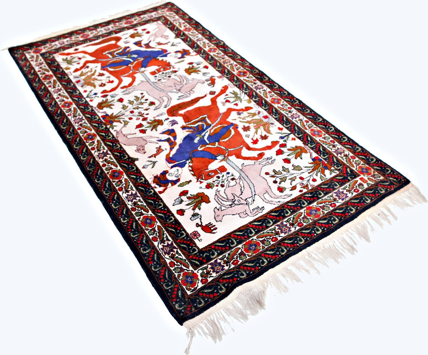 A vintage handmade Persian rug featuring a traditional hunting scene on a white background.