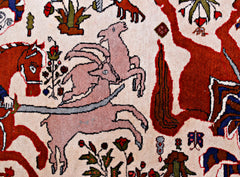A vintage Persian rug featuring a detailed hunting scene with animals on a cream background.