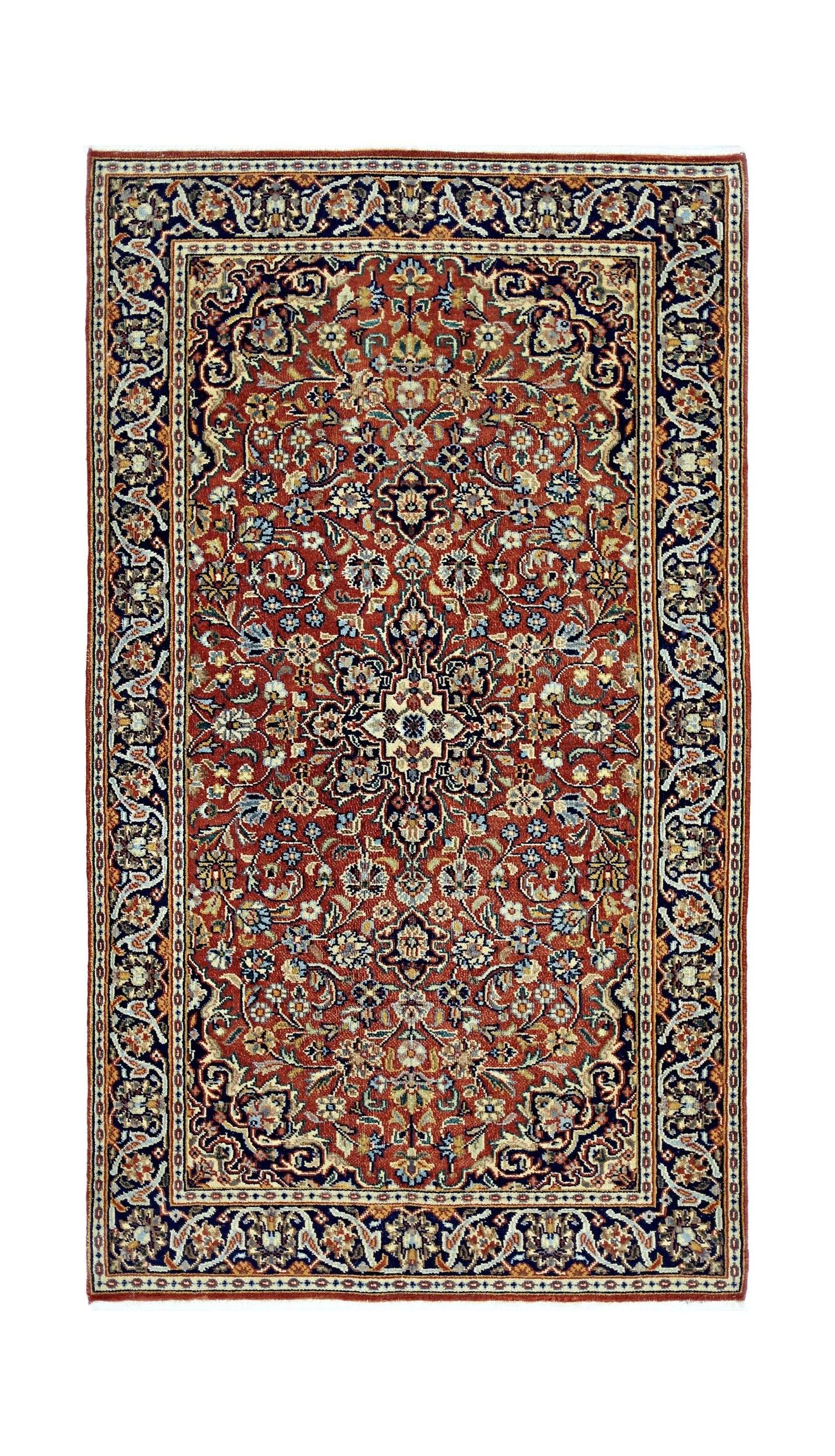 A rectangular vintage Persian rug featuring an intricate floral pattern in red, blue, and cream.