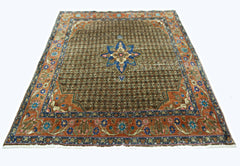 A vintage handmade Persian rug featuring a brown field with a central blue floral medallion.