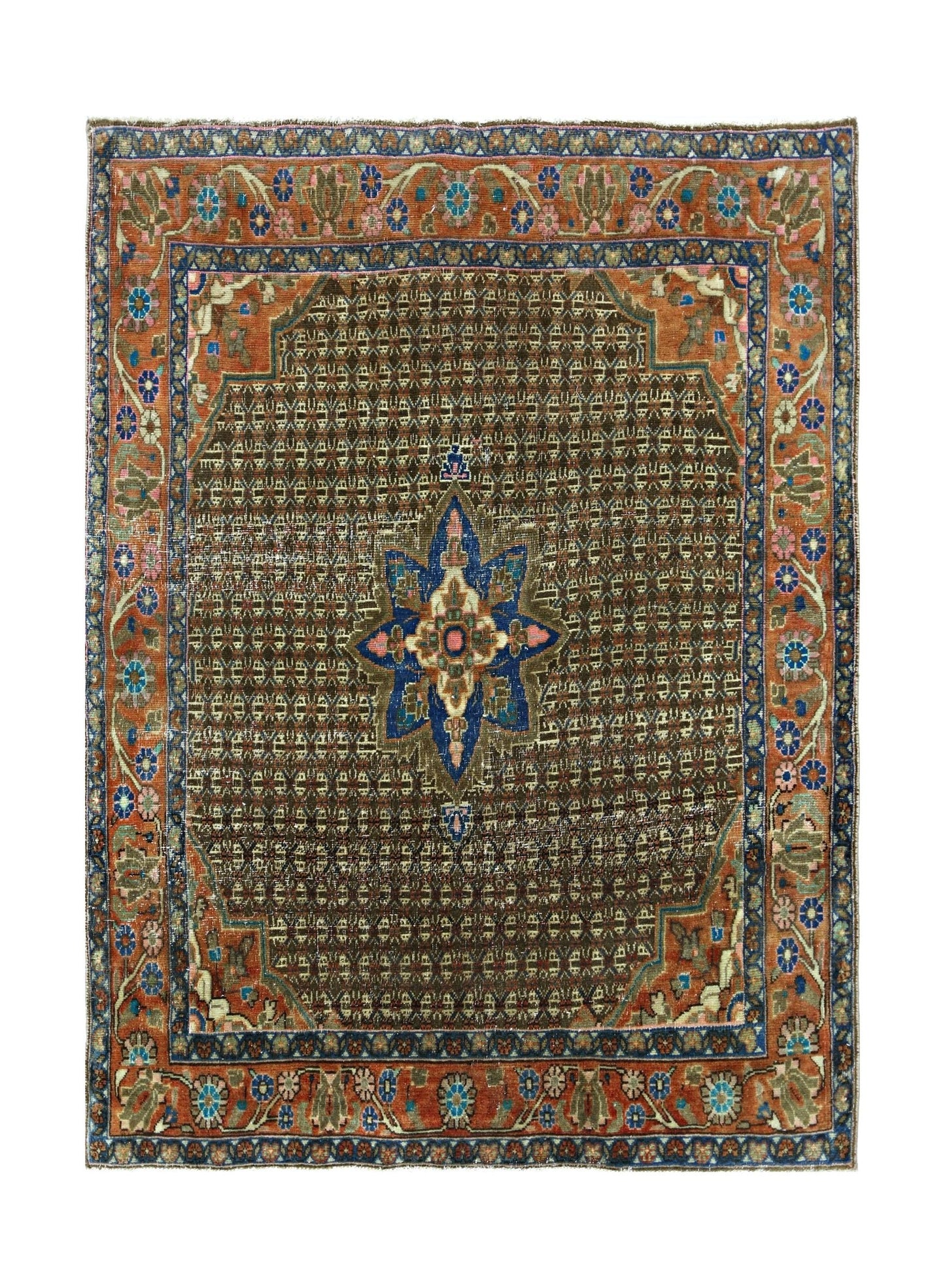 A vintage handmade Persian rug featuring a central blue floral medallion on a brown field.