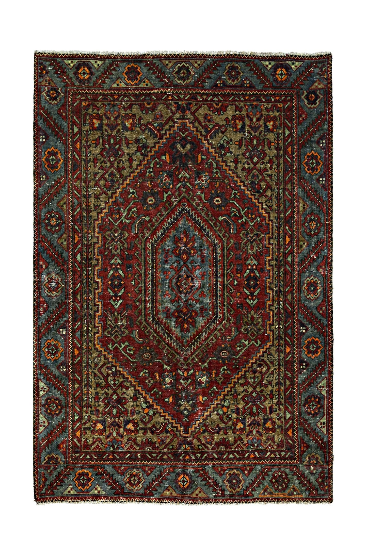 A vintage handmade Persian rug featuring a central diamond medallion in red, blue, and olive tones.