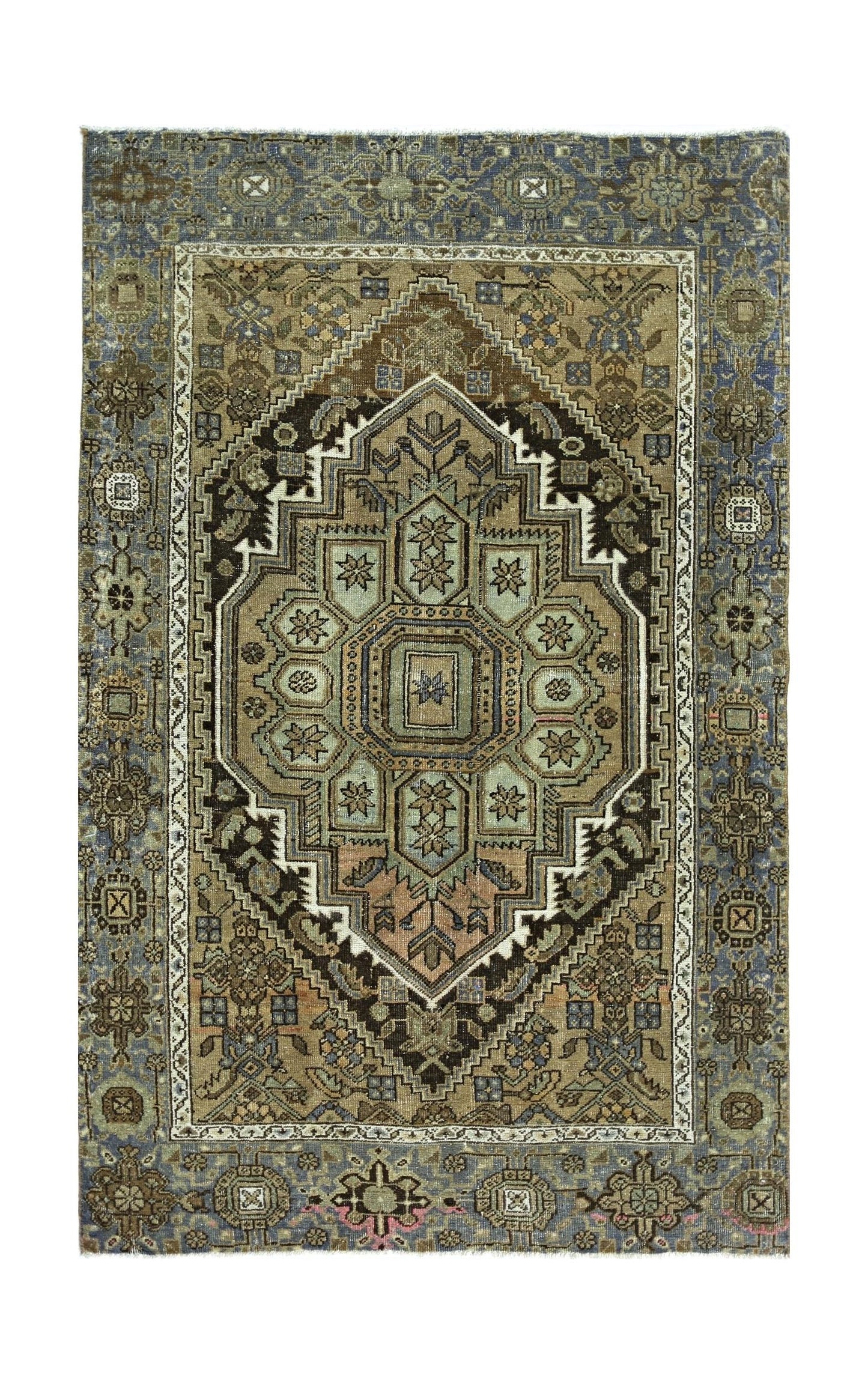 A vintage handmade Persian rug featuring a central geometric medallion in muted earth tones.