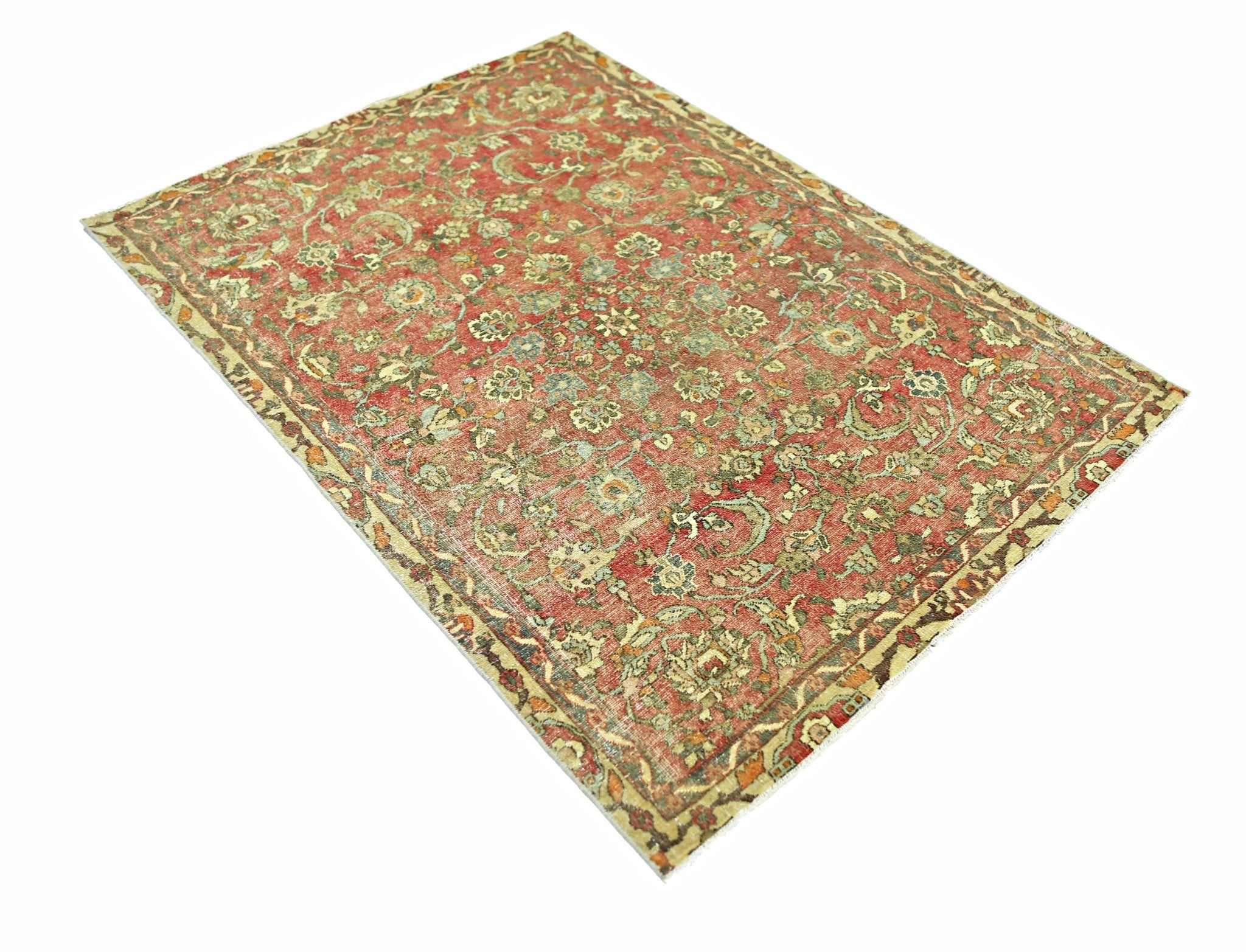 A rectangular vintage Persian rug featuring an intricate floral pattern in red and muted green tones.