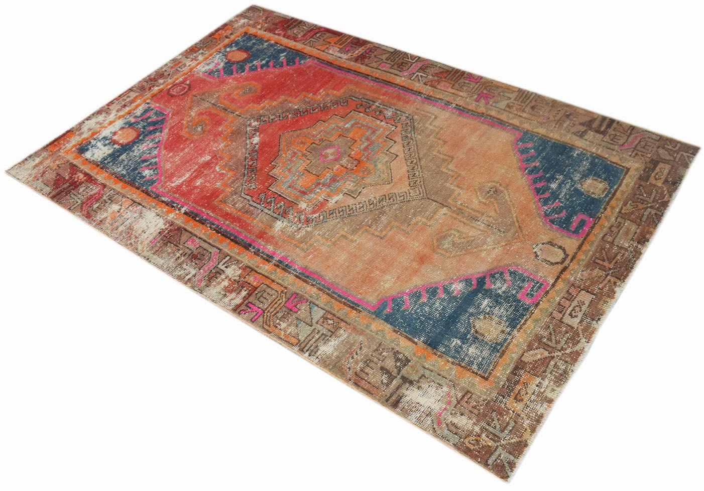 A vintage handwoven Persian rug featuring a geometric medallion in shades of red, orange, and blue.