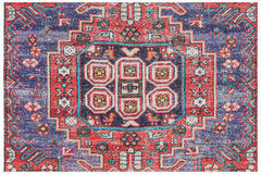 Vintage Persian rug with intricate red, blue, and purple geometric patterns.