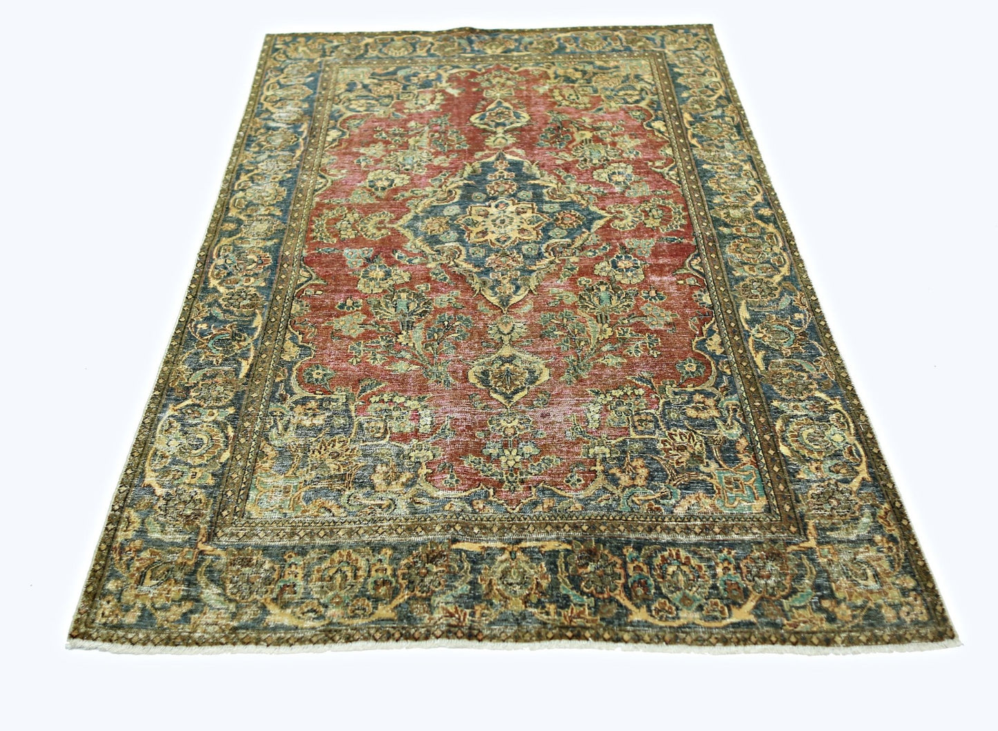 A vintage Persian rug featuring a central medallion and intricate floral patterns in red and blue.