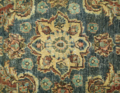 A vintage Persian rug featuring a central floral medallion in muted tones on a dark background.