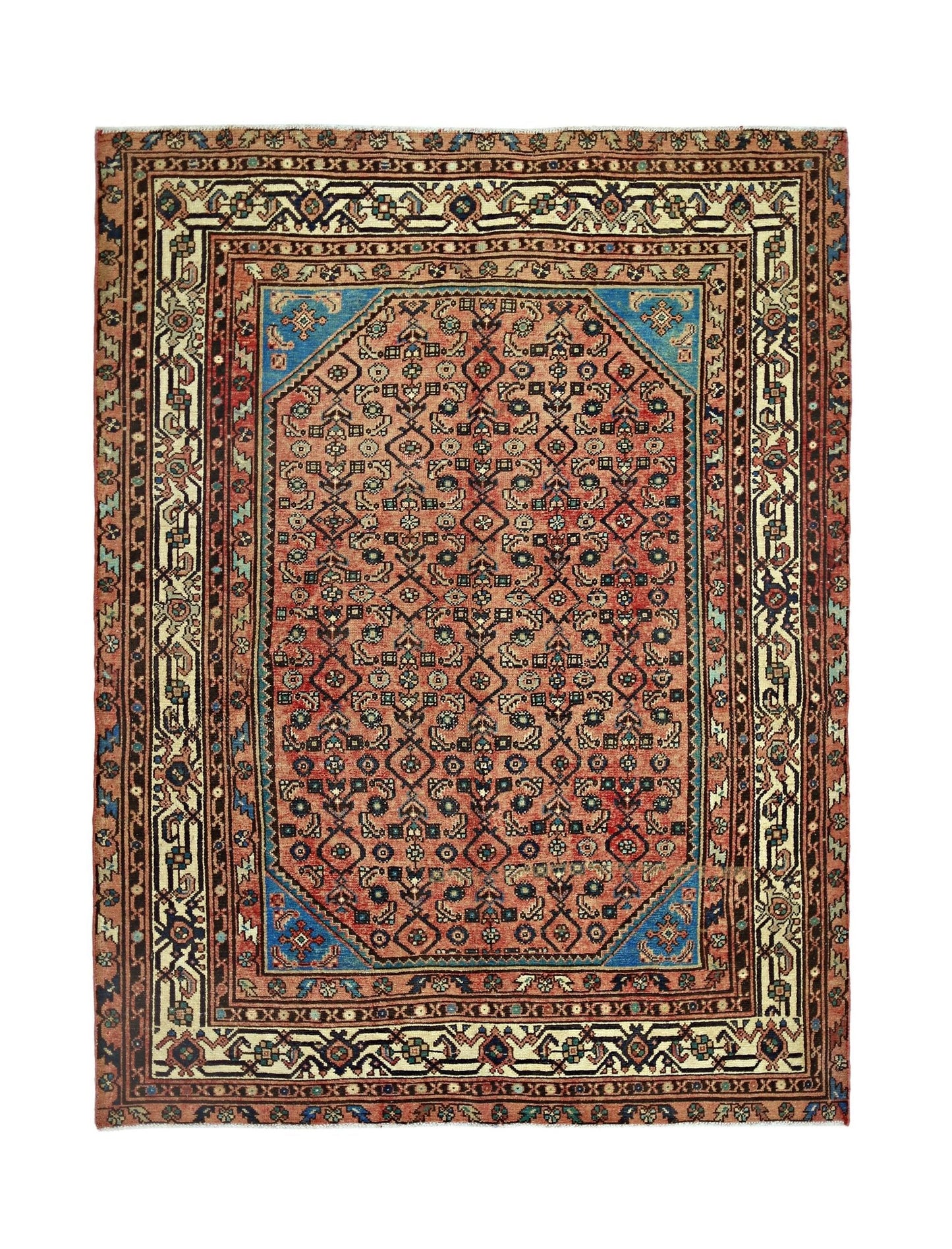 A vintage handmade Persian rug featuring a geometric floral pattern in red and blue tones.