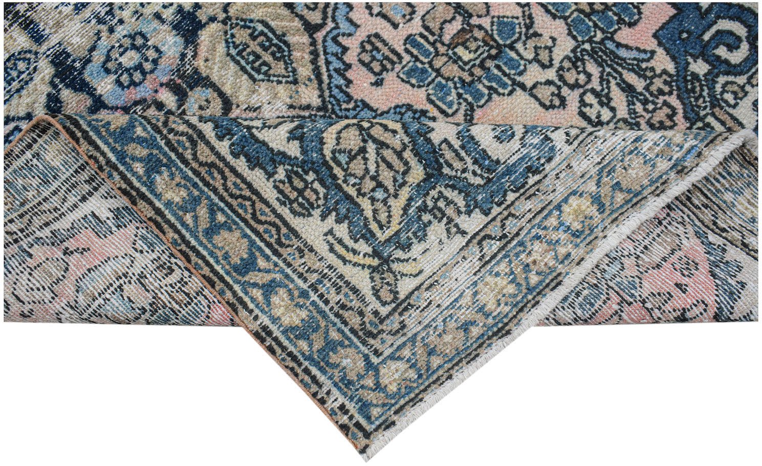 Vintage Persian rug with intricate blue, pink, and beige patterns.