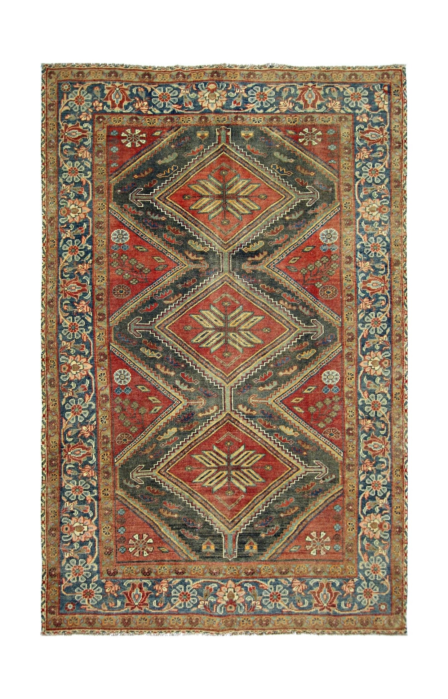A vintage handmade Persian rug featuring three central diamond medallions in red and dark blue.