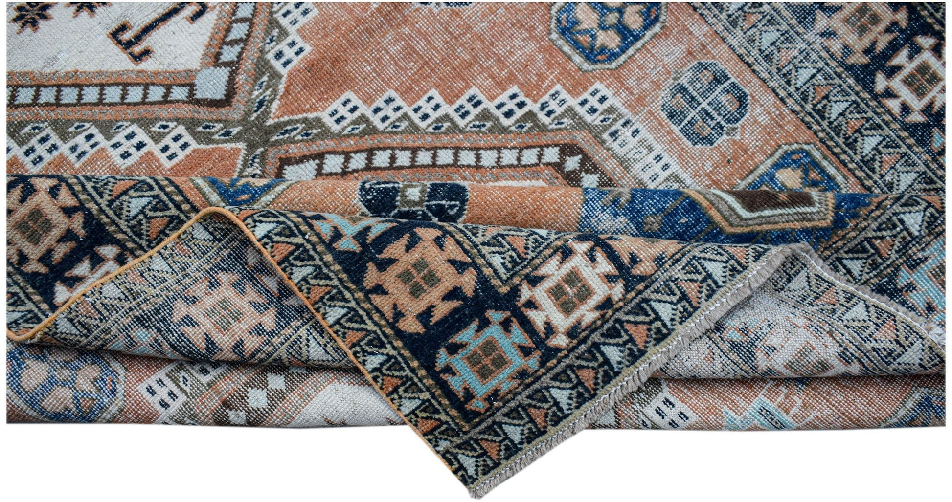 A handwoven vintage Persian rug featuring geometric patterns in shades of orange, blue, and cream.